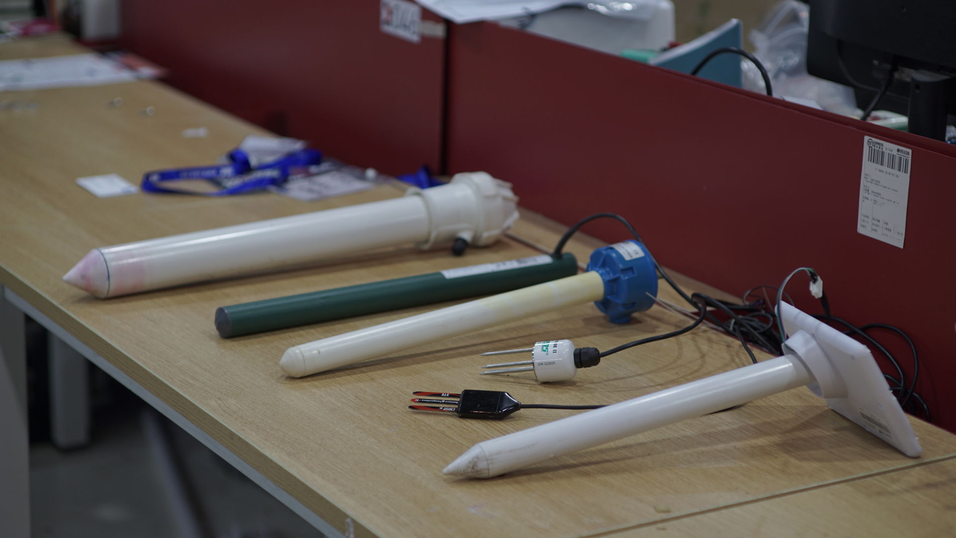 Soil moisture probes arranged on a workbench